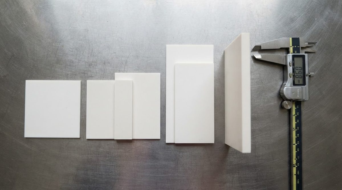 Alumina ceramic substrates in multiple thicknesses with caliper for comparison