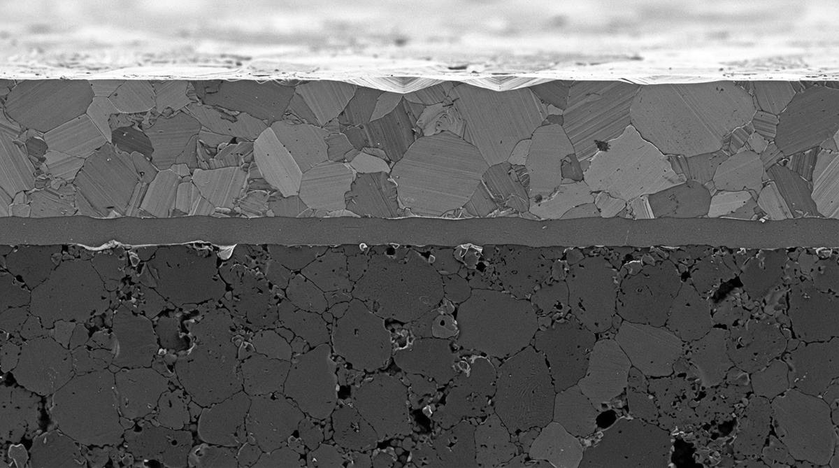 Microscope cross-section of a DBC copper bond on an alumina ceramic substrate
