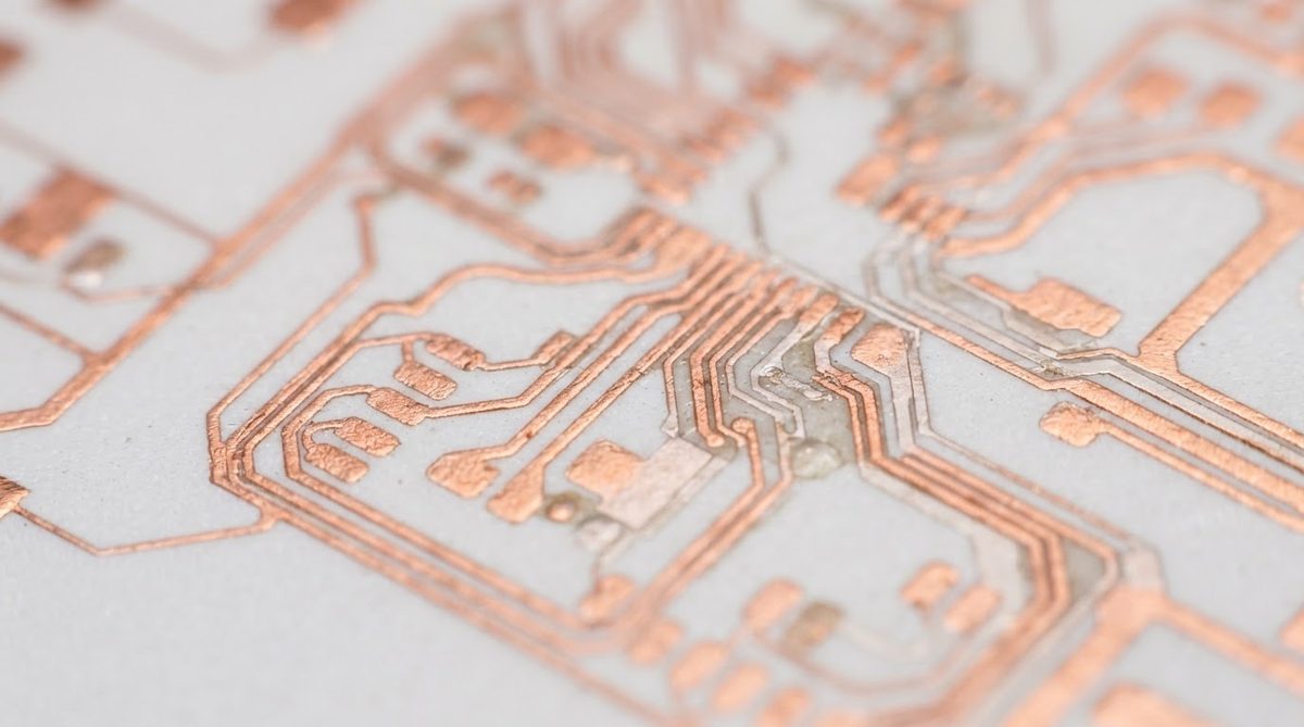 Thin-film copper traces on a 99.6% alumina substrate under magnification