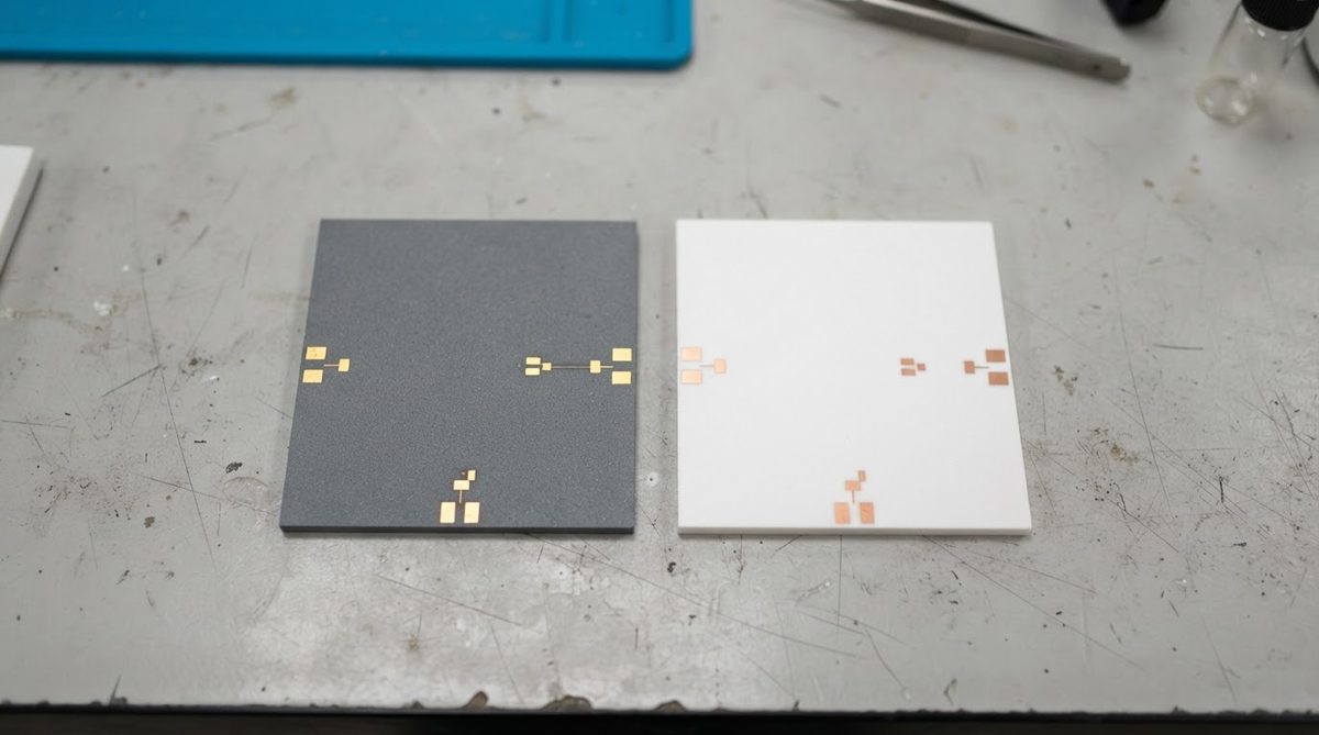 Alumina and AlN ceramic substrates compared side by side on a lab bench