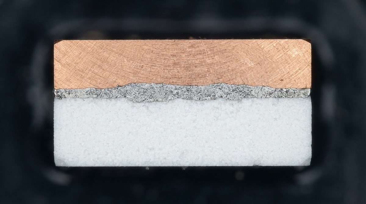Cross-section of an AMB substrate showing copper, braze, and ceramic layers