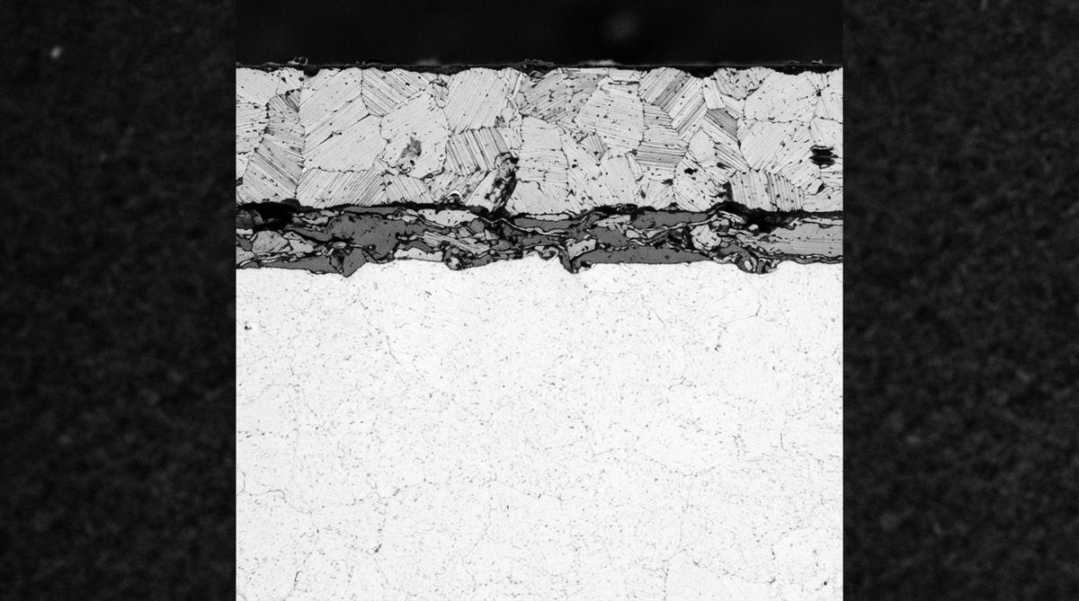 Cross-section micrograph of an AMB substrate showing copper, braze layer, and ceramic