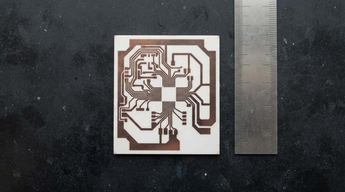 Metallized AlN DBC substrate with copper traces shown next to a ruler for scale
