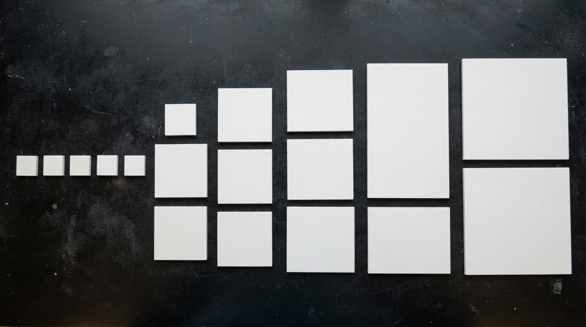 Alumina substrates in various standard sizes arranged on a lab bench for comparison