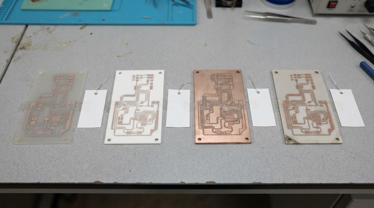 Assorted ceramic PCB substrates including alumina and aluminum nitride on a workbench