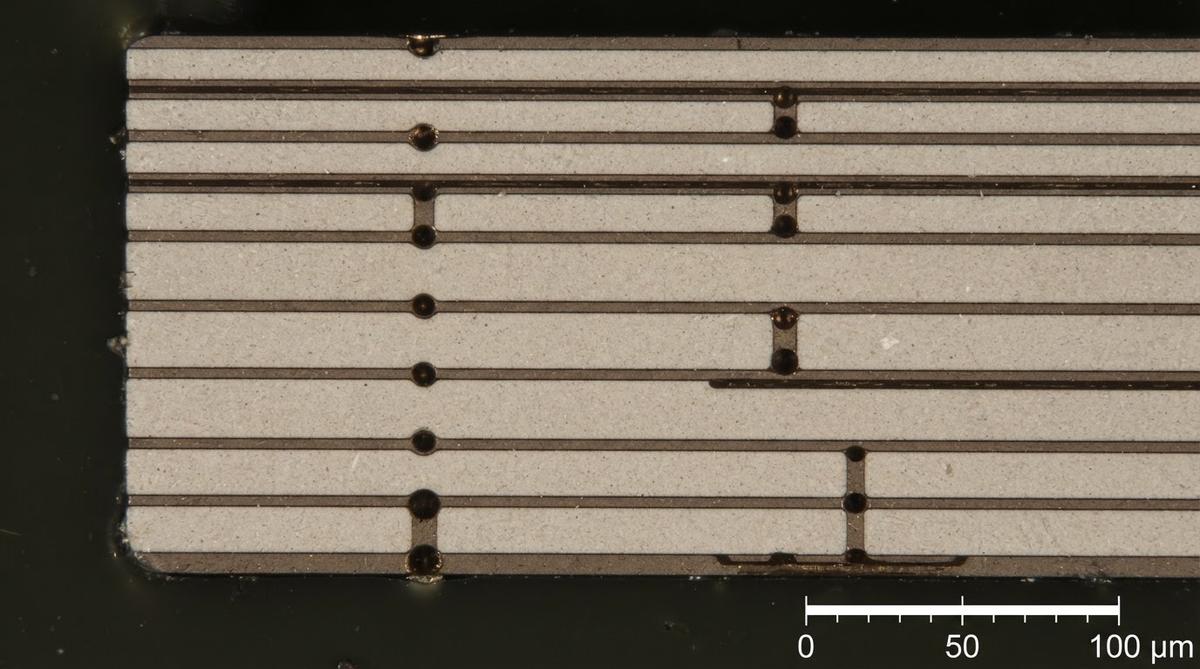 Cross-section of a multilayer LTCC substrate showing embedded conductor layers