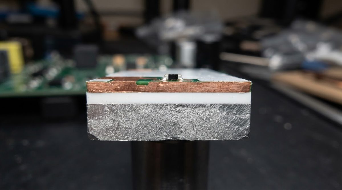 Cross-section of a metal-core PCB revealing copper, dielectric, and aluminum layers