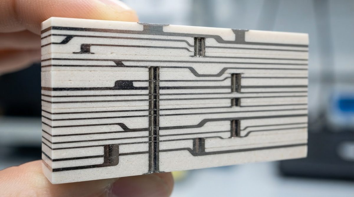 Cross-section of a multilayer LTCC module showing silver traces and filled vias