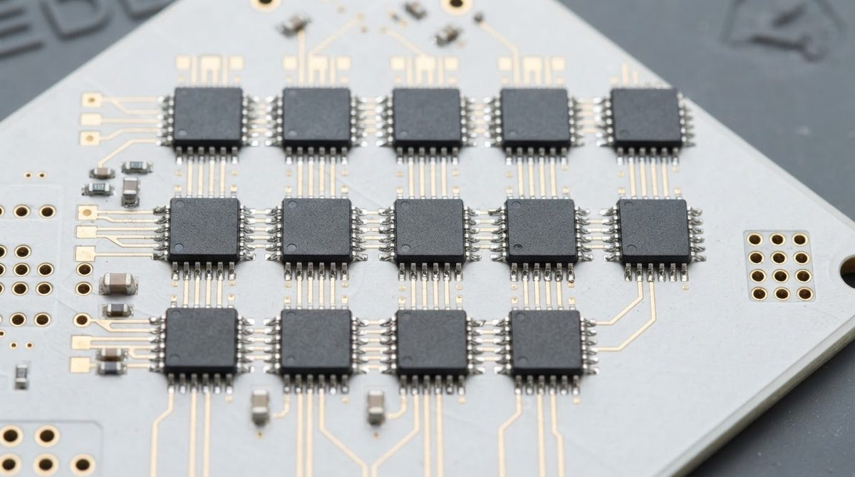 Reflowed QFN components on a white alumina ceramic PCB