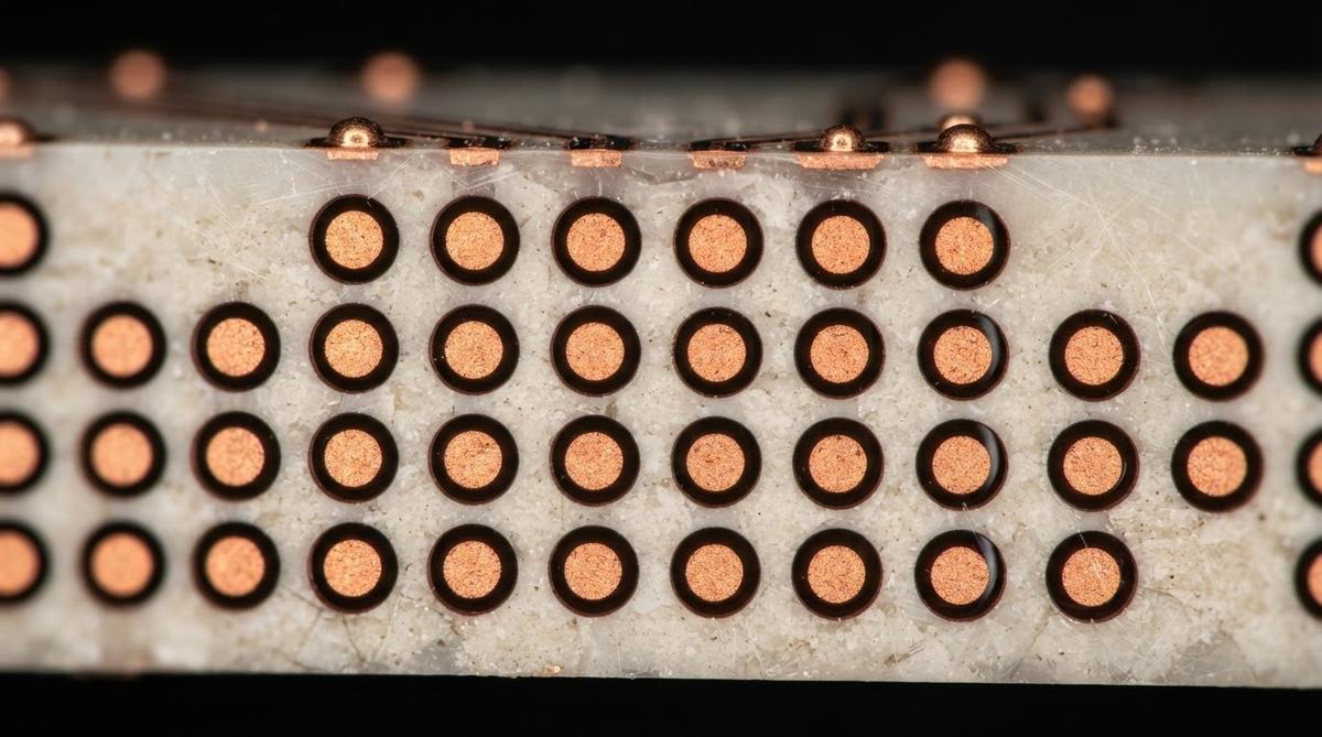 Microscope view of copper-filled through-glass vias in a glass interposer