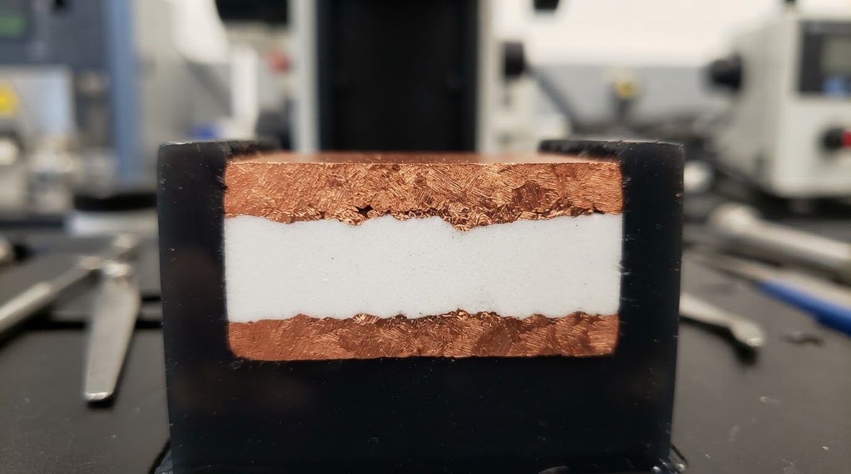 Cross-section of copper foil bonded to an alumina ceramic substrate via DBC