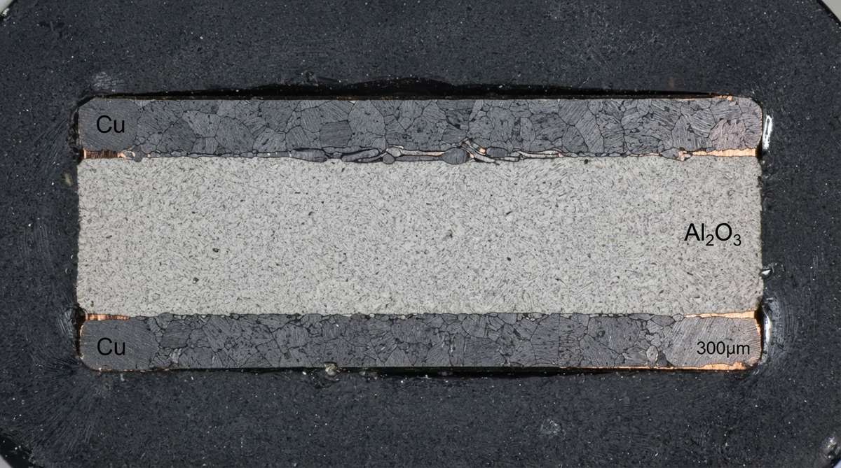 Cross-section of a DBC copper-alumina substrate showing bonded layers