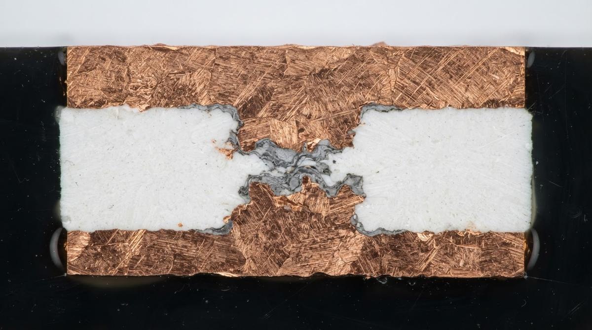 Cross-section of a DBC substrate showing the copper-to-ceramic bond layer