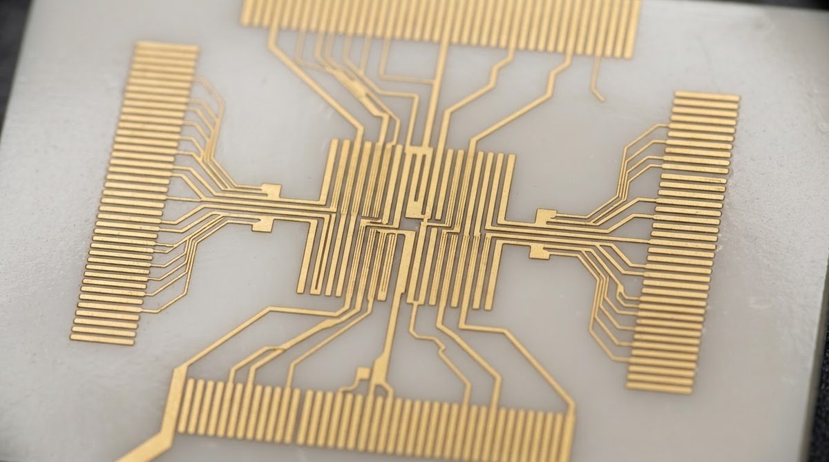 Thin-film ceramic circuit with fine RF features viewed under a microscope