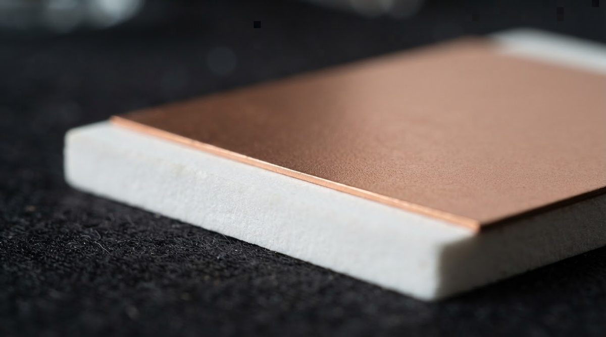 Thin electroless copper film deposited on a white alumina ceramic coupon