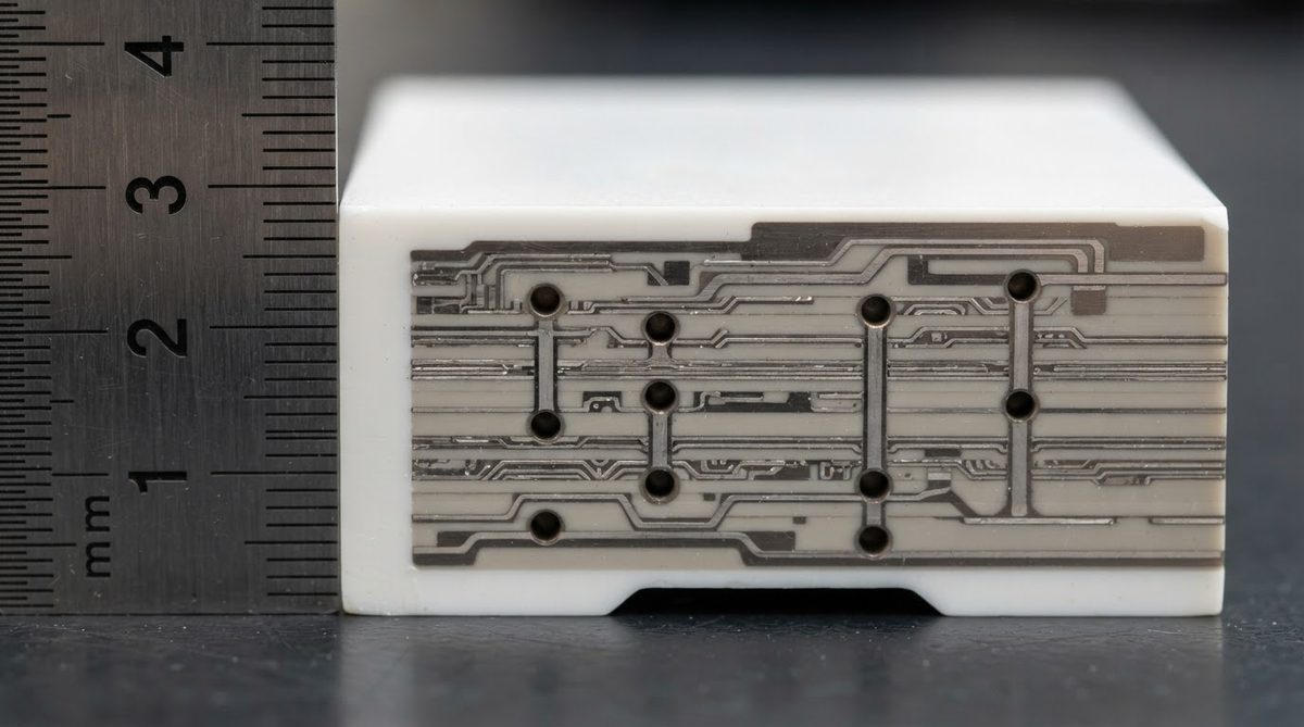 Cross-section of a multilayer ceramic substrate with internal vias and conductor layers