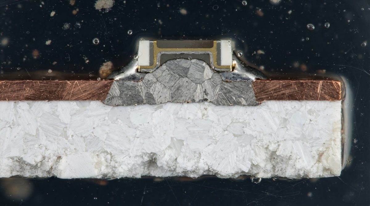 Cross-section of a ceramic PCB showing substrate, conductor, and solder layers