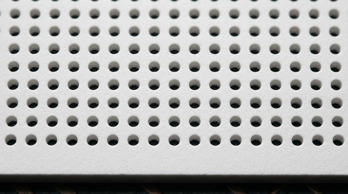 Grid of laser-drilled vias in a fired ceramic PCB substrate
