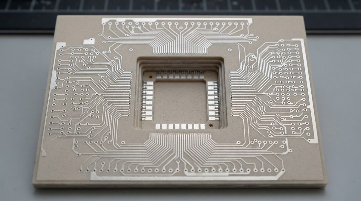 Fired LTCC substrate with silver traces, via pads, and open die-attach cavity