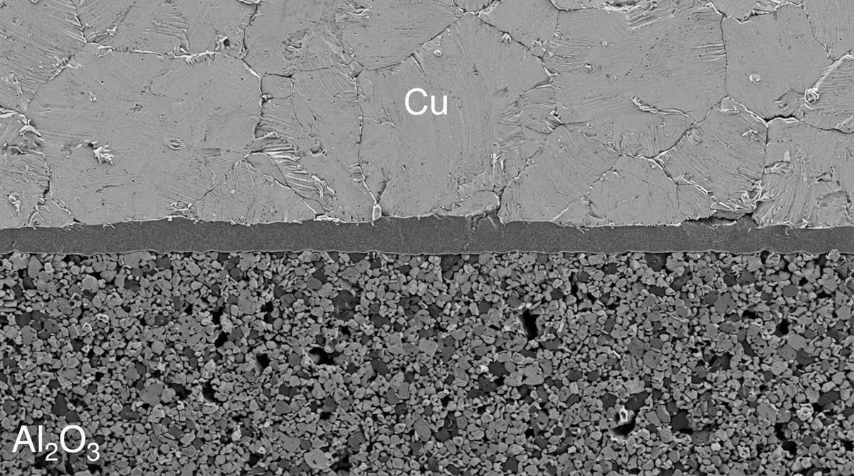 Cross-section of a DBC copper-to-alumina bond interface
