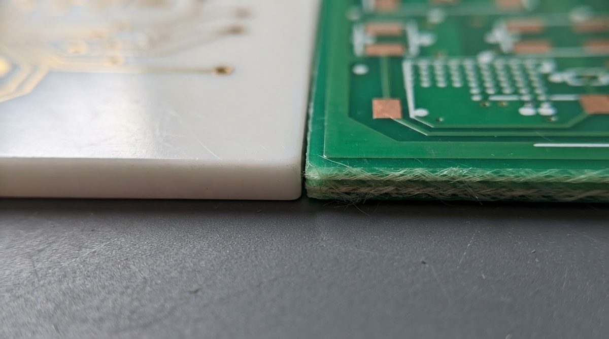 Alumina ceramic substrate compared side by side with an FR-4 board