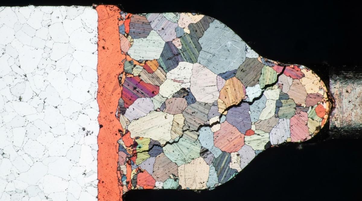 Cross-section of a solder joint on a ceramic PCB substrate revealing a fatigue crack