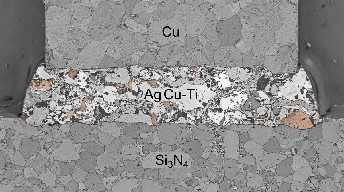 Cross-section of AMB copper-to-ceramic bond showing braze interlayer