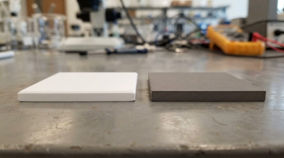 96% alumina substrate beside an aluminum nitride substrate for material comparison