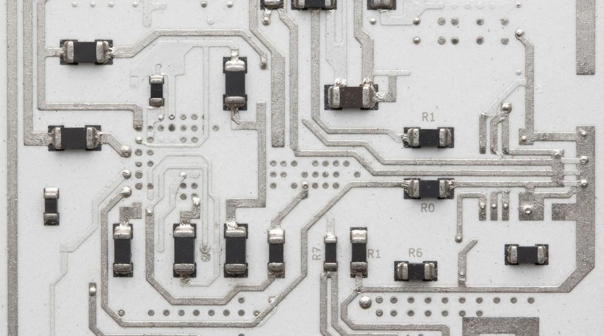 Thick film ceramic circuit with printed conductors and embedded resistors on alumina