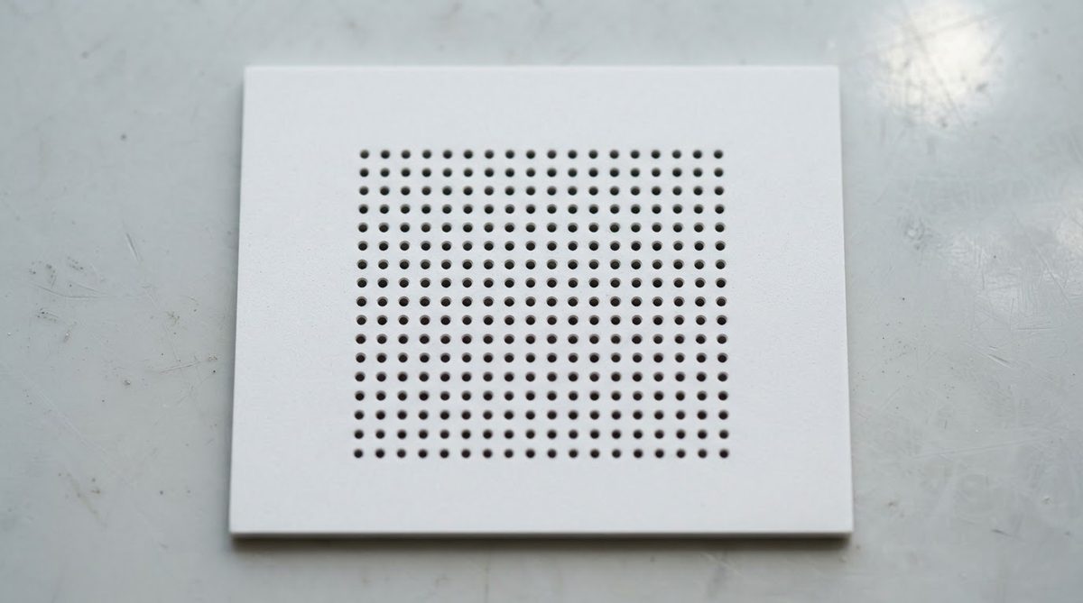Alumina ceramic board with a grid array of filled thermal vias